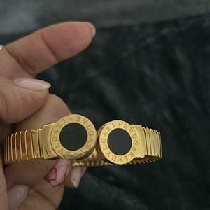 Gold and black bracelet